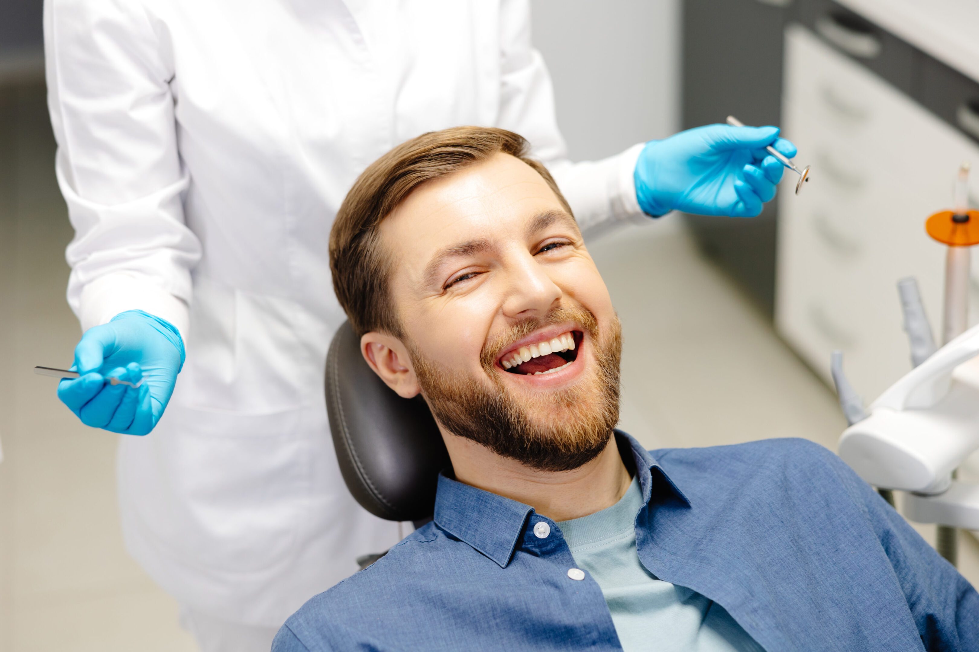 Man smiling at dental clinic visit