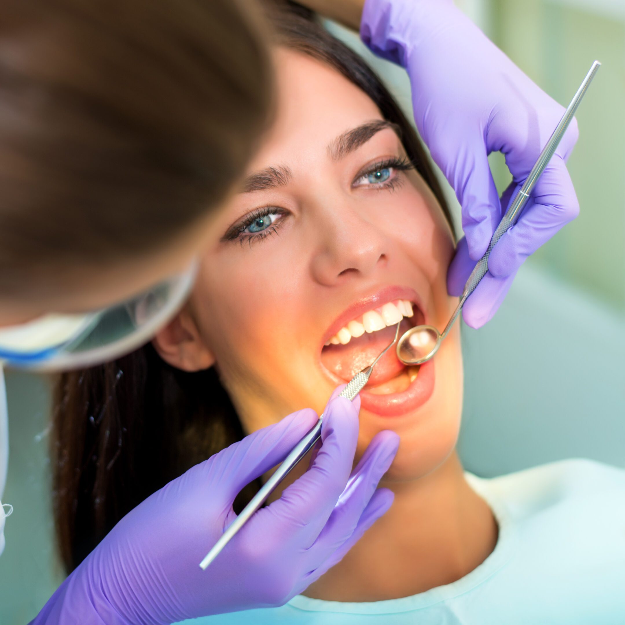 Dental tools in patient's mouth